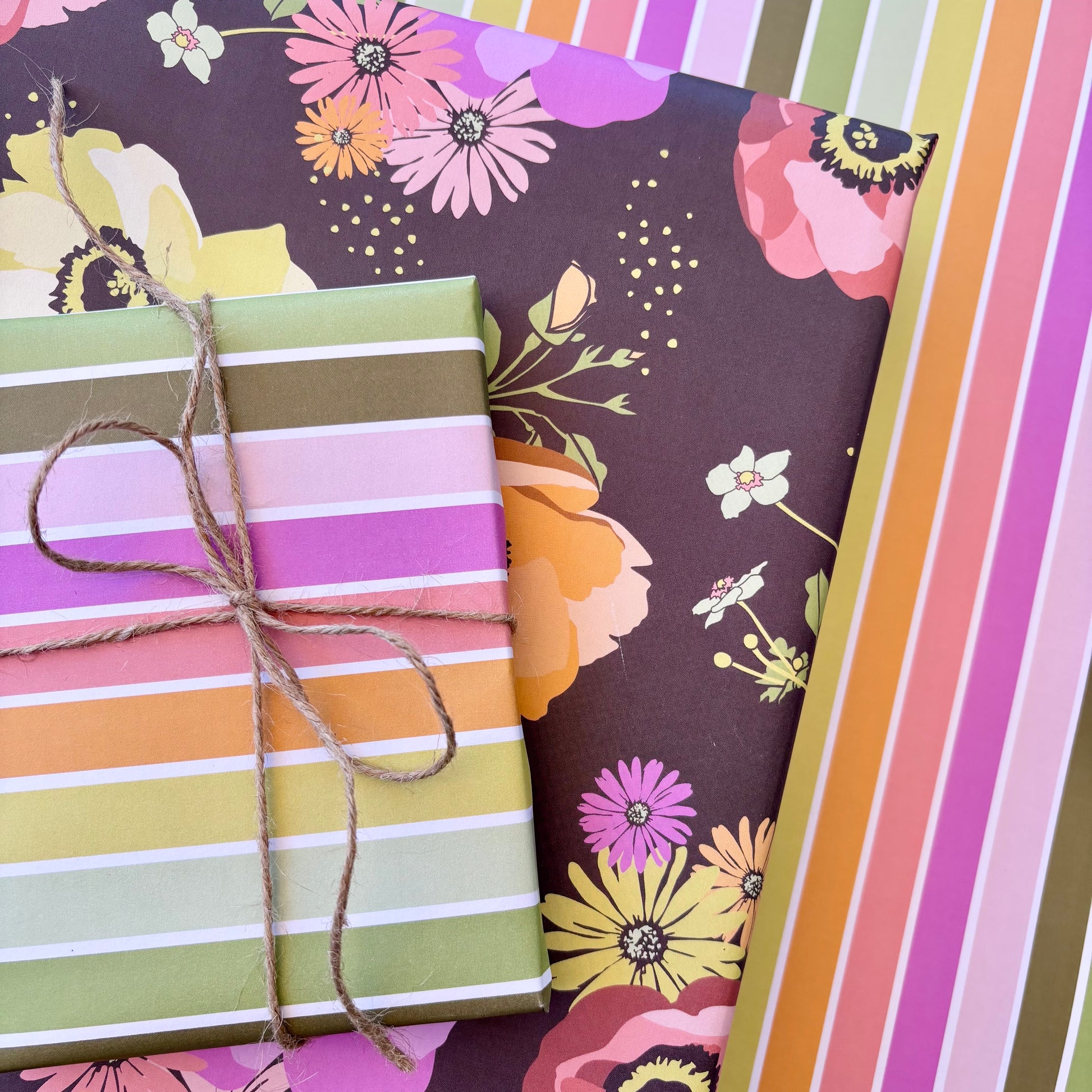 Colorful striped gift wrap with a floral pattern on a matching background