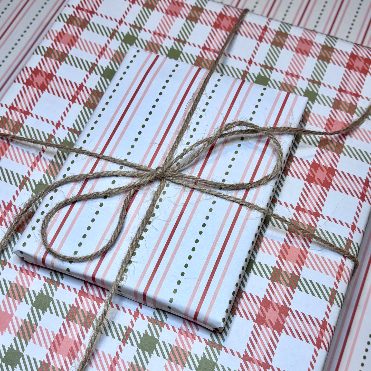 Gift box wrapped in plaid paper with twine