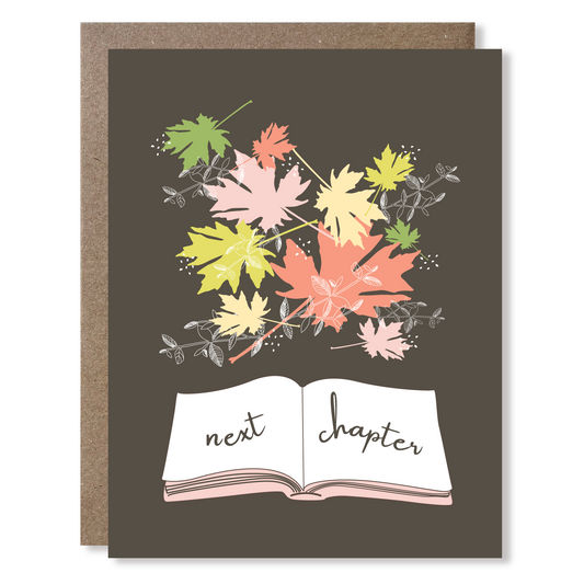 Greeting card with colorful leaves and 'next chapter' text on a dark background