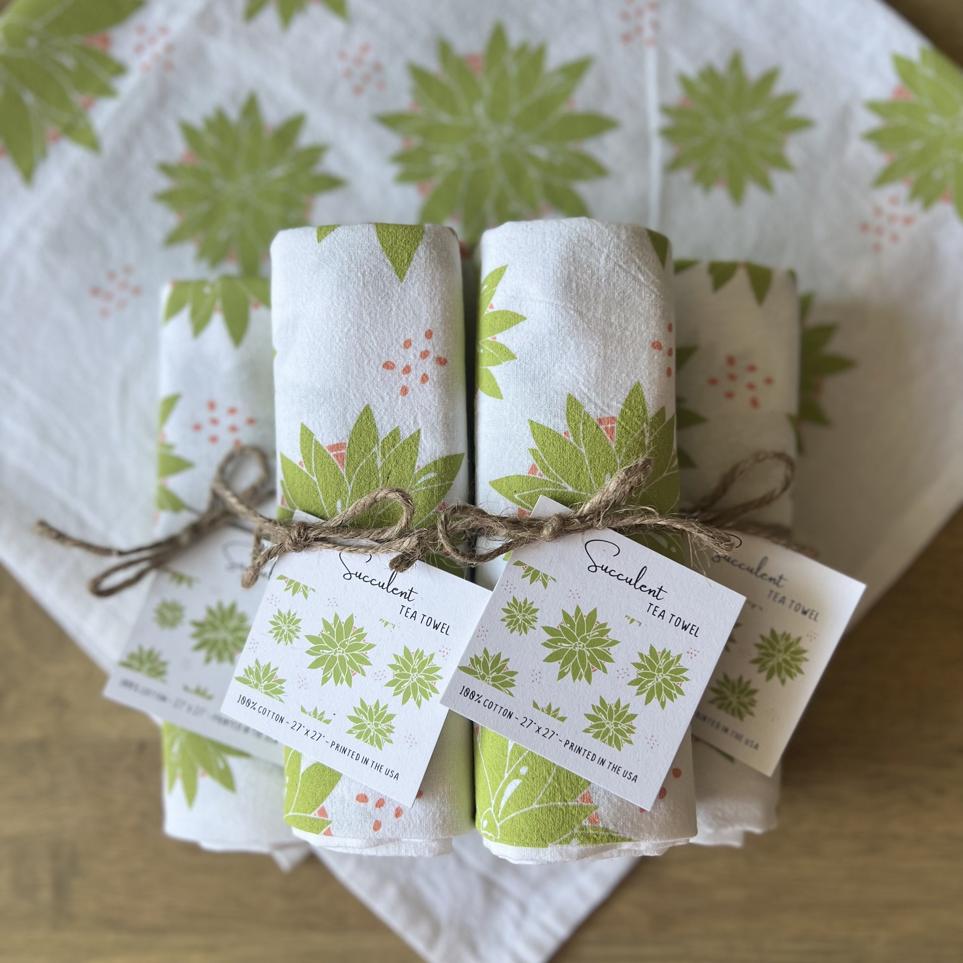 Pile of succulent tea towels tied with twine and hangtags