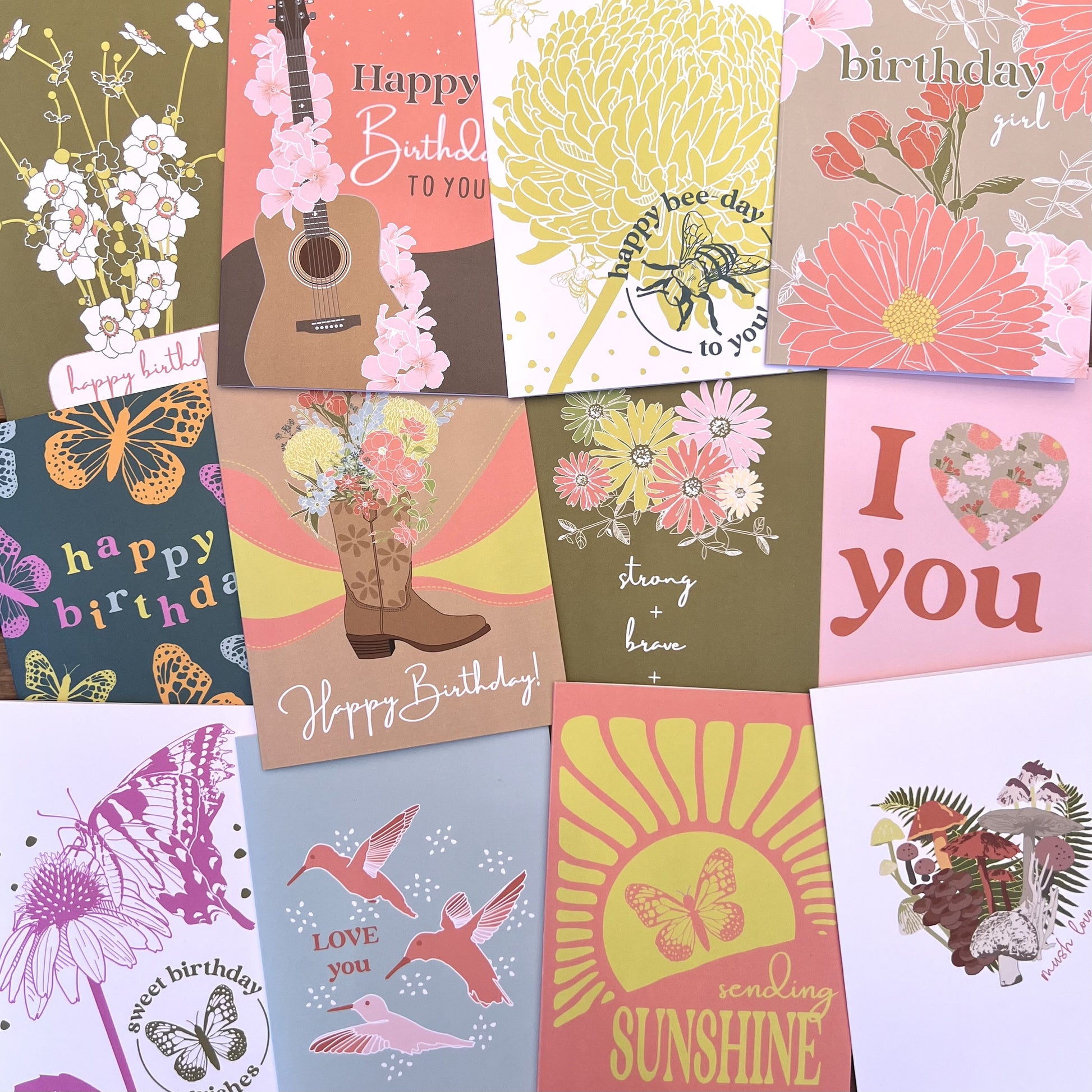 Flat lay shot of twelve assorted colorful greeting cards