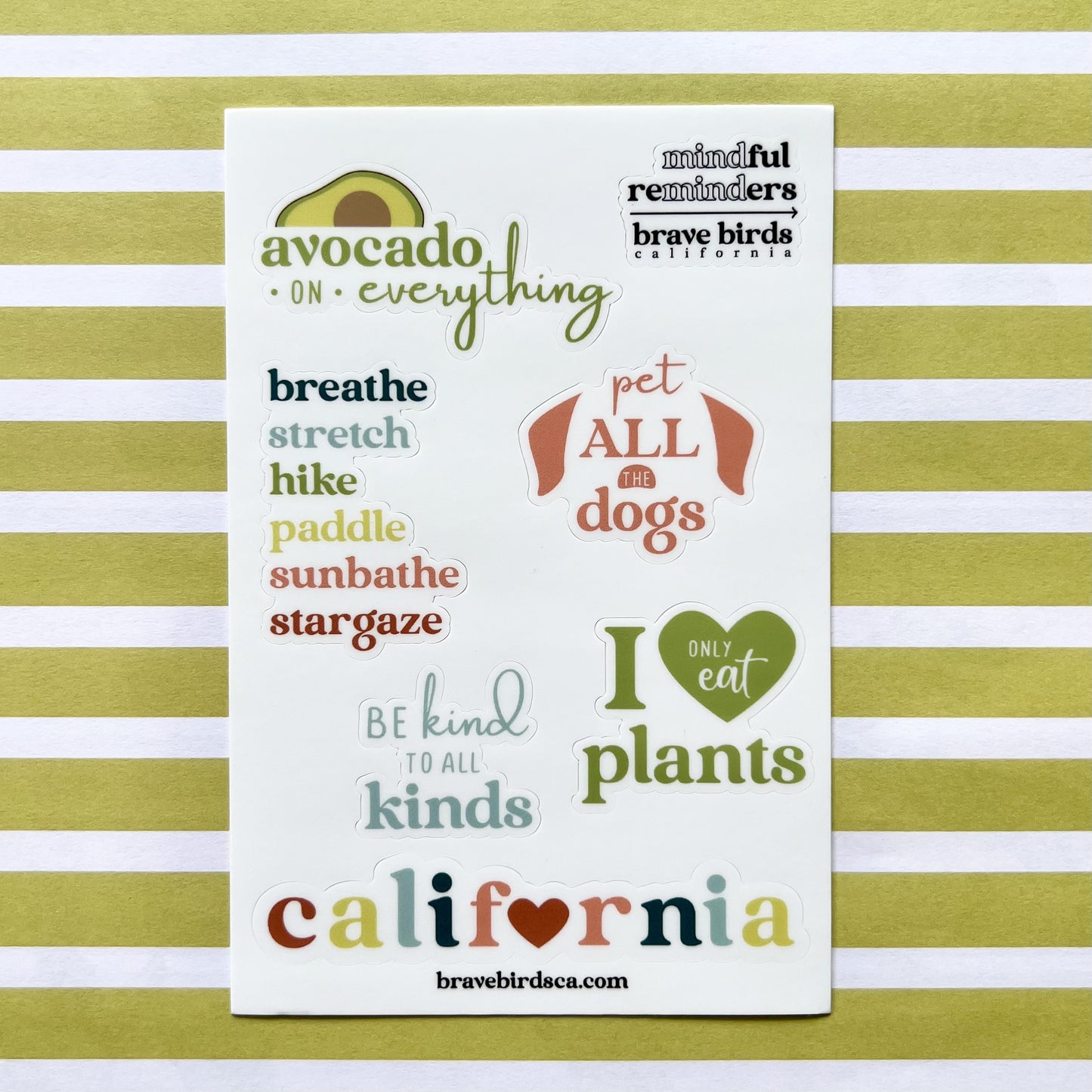 sticker sheet with California inspired sayings like "avocado on everything", "be kind to all kinds" and "pet all the dogs"