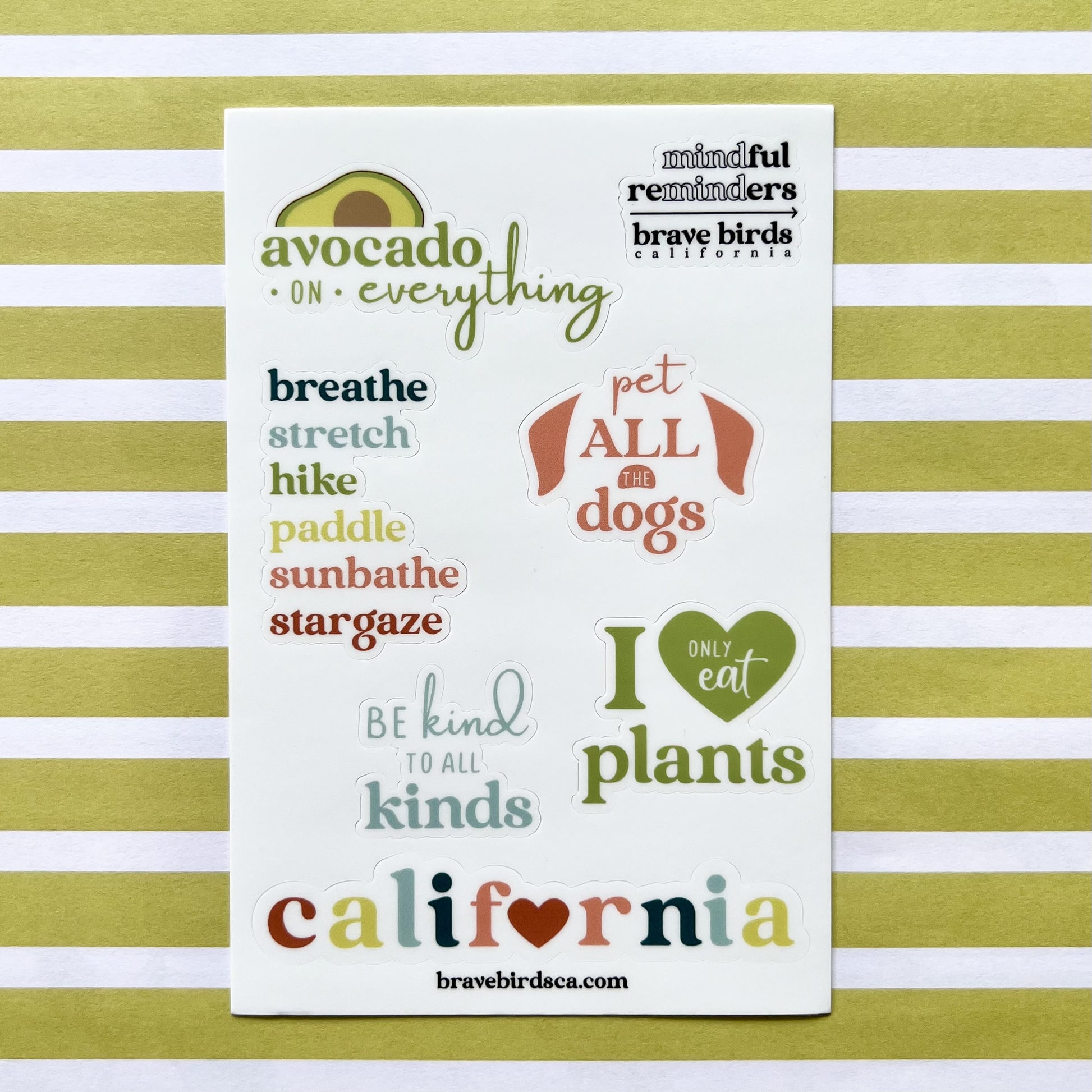 sticker sheet with California inspired sayings like "avocado on everything", "be kind to all kinds" and "pet all the dogs"
