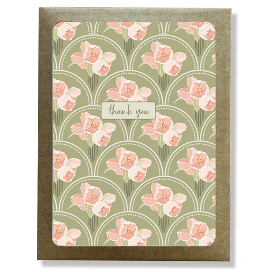 Kraft paper box with a cutout window showing a pink and green floral print thank you card