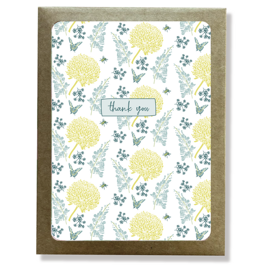 Kraft paper box with a cutout window showing a blue and yellow floral print thank you card