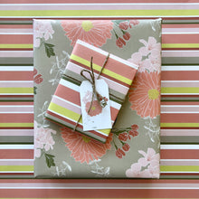 Load image into Gallery viewer, Two gift boxes, one wrapped in coral floral pattern, one wrapped in warm stripe, tied with twine and topped with a floral gift tag
