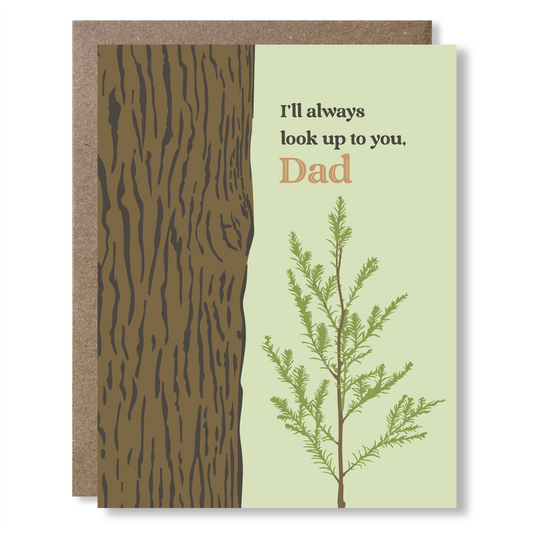 Greeting card with illustration of a sapling next to a huge tree trunk, with text reading "I'll always look up to you, Dad"