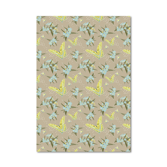 Gift wrap sheet featuring a repeating pattern of light blue flowers, green leaves, and yellow butterflies on a warm beige background, shown against a plain white backdrop.