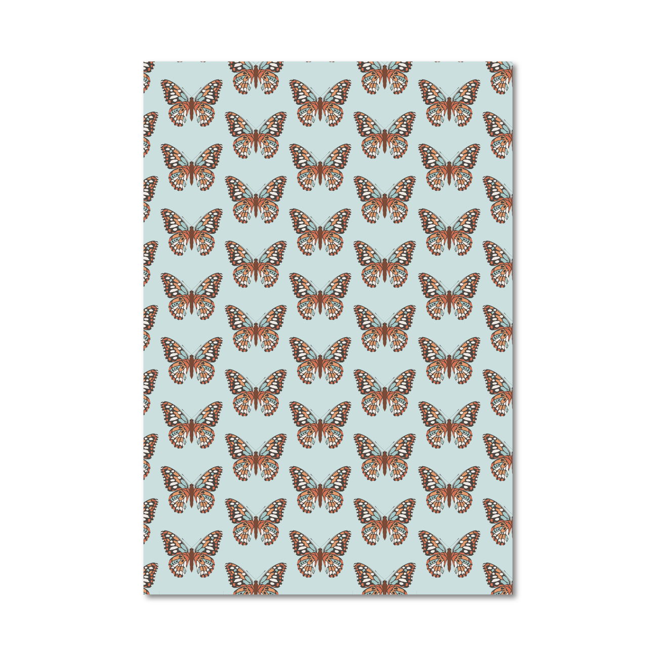 Patterned gift wrap sheet with an orange butterfly pattern on a light blue background