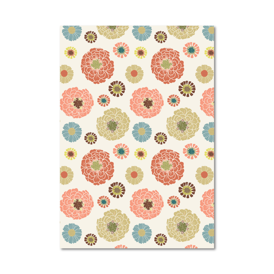 Patterned gift wrap sheet with colorful floral print in shades of red, pink, green and blue on a cream background