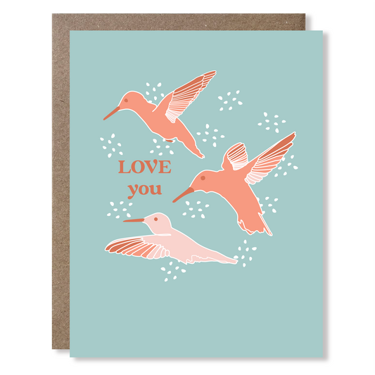 Greeting card with pink hummingbirds and 'LOVE you' text on a light blue background