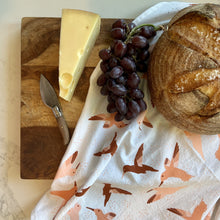 Load image into Gallery viewer, Hummingbird tea towel shown with a wood platter, bread, cheese and grapes
