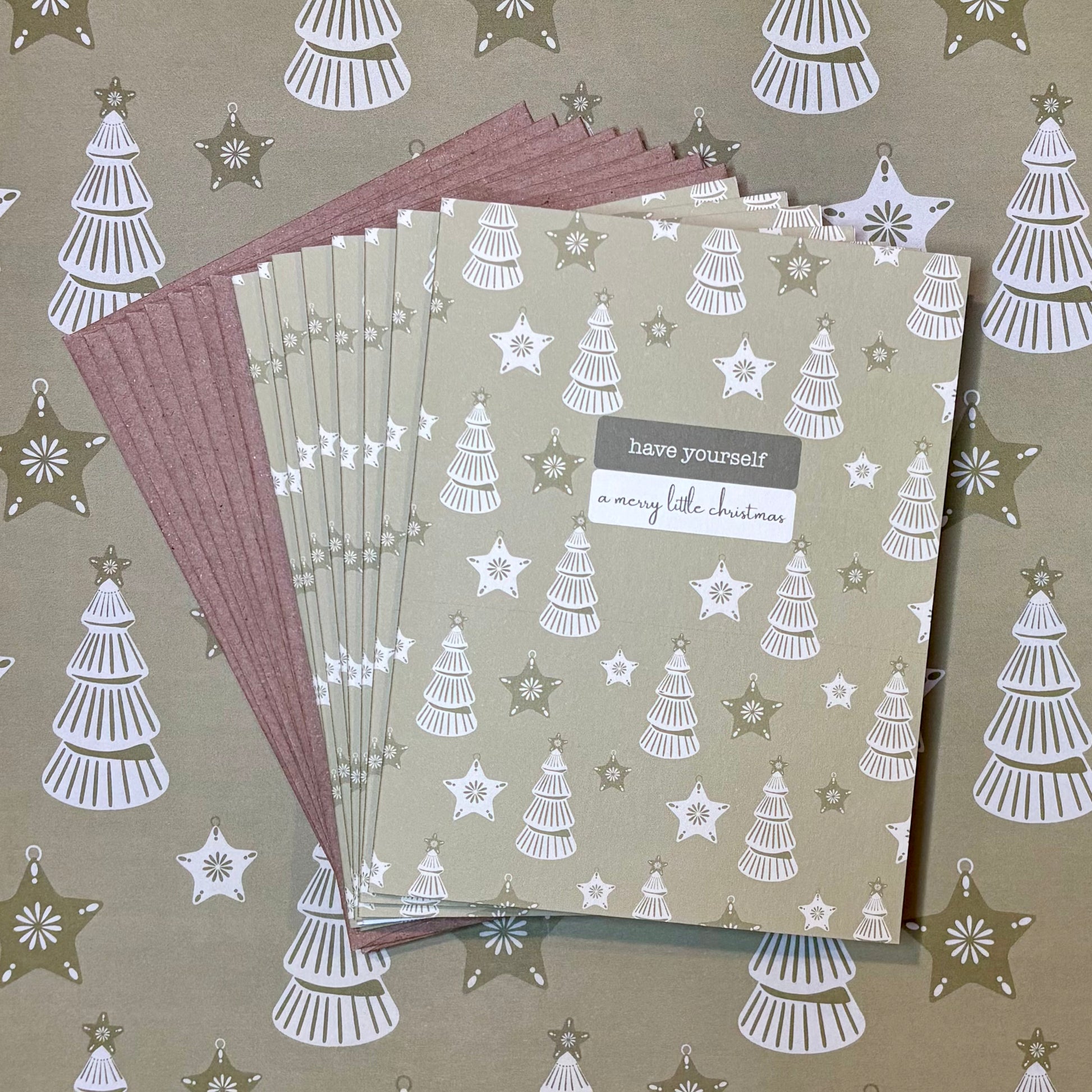 Set of cards with Christmas tree and star patterns on a matching background