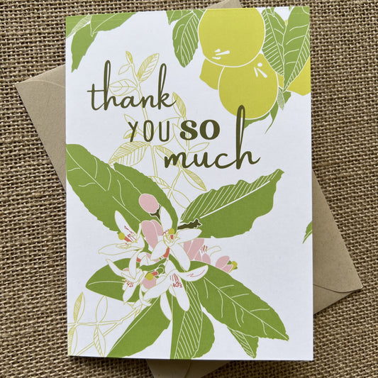 lemons, leaves and white flowers with the words "thank you so much" in olive green type, shown with a kraft paper envelope
