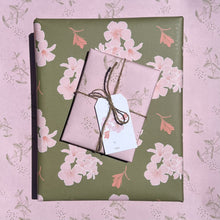 Load image into Gallery viewer, Two gift boxes, one wrapped in olive ground print, one wrapped in light pink print, tied with twine, and topped with a pink blossom gift tag

