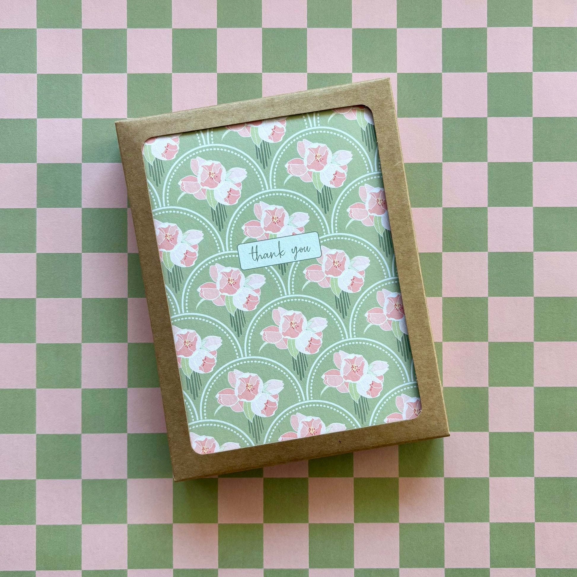 Box of cards featuring pink flower bunches on a green scallop pattern and the words thank you 