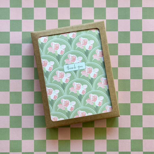 Box of cards featuring pink flower bunches on a green scallop pattern and the words thank you 