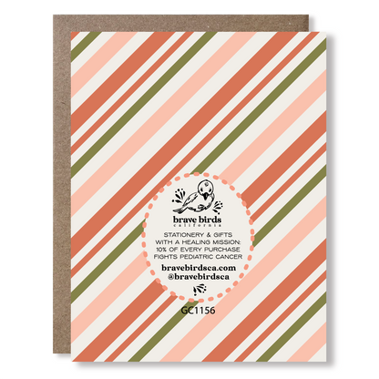 Greeting card back view with red and green stripes and brand logo and text reading 'brave birds california stationery & gifts with a healing mission: 10% of every purchase fights pediatric cancer'