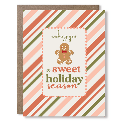Greeting card with a gingerbread man and stripes, with text reading 'wishing yo ua sweet holiday season'