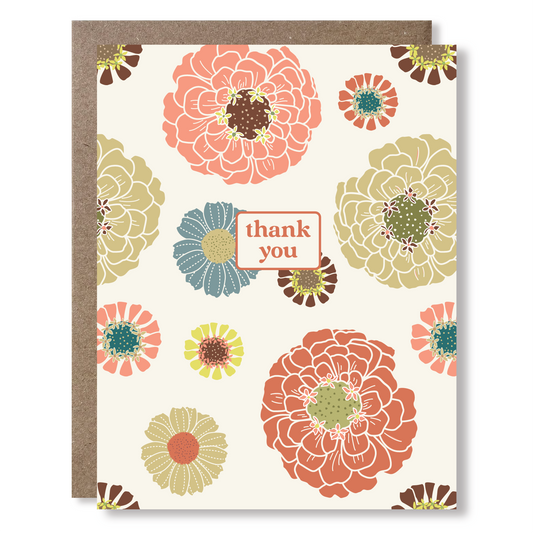 greeting card with colorful flowers on a cream background and text reading "thank you"