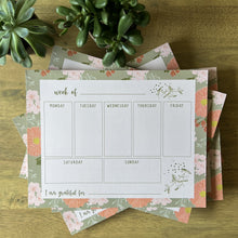 Load image into Gallery viewer, Weekly Planners styled in a pile with succulents on a wood table
