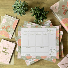 Load image into Gallery viewer, Pile of weekly planners styled with coordinating pattern items, cards and wrapping paper
