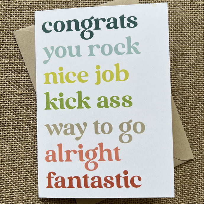 White background with words in rainbow colors: congrats, you rock, nice job, kick ass, way to go, alright, and fantastic, shown with a kraft paper envelope