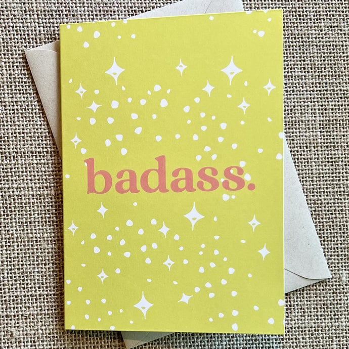 Citron yellow background with white sparkles and the word badass in pink