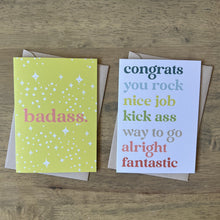 Load image into Gallery viewer, Two greeting cards, both with same type face, one says badass in pink on citron background with white stars, the other has words of congratulations in rainbow colors
