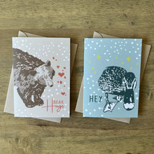 Load image into Gallery viewer, Two greeting cards, one with a bear illustration saying bear hugs, the other with a duck illustration saying hey

