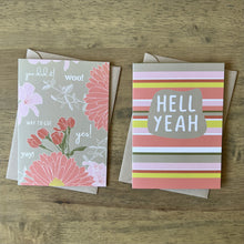 Load image into Gallery viewer, Two greeting cards, one with allover floral print and words of congratulations in white text, the other saying HELl YEAH with warm multi colored stripe background
