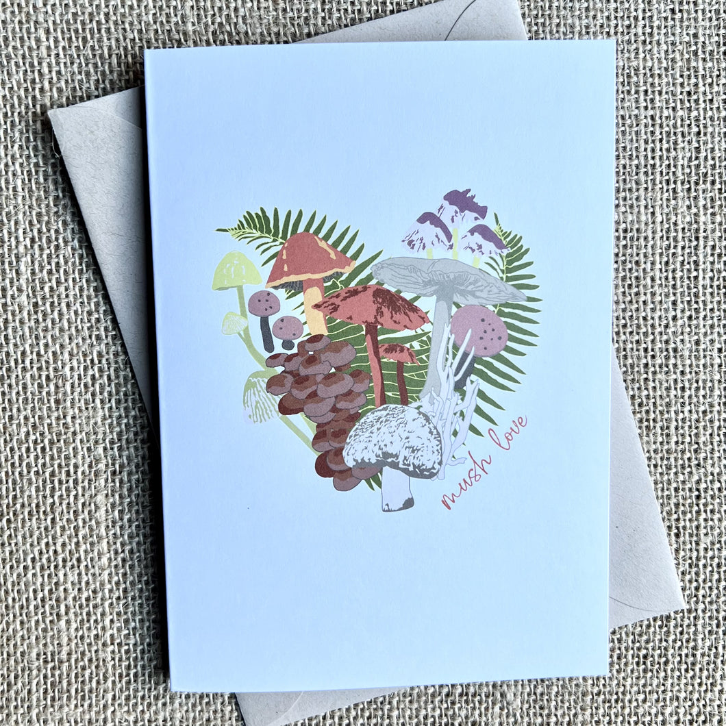 White card with a heart shaped cluster of muchrooms in shades of green, taupe & pink.