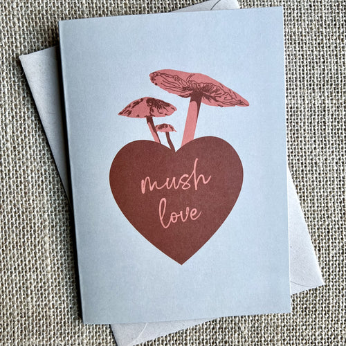Khaki background greeting card with a red heart and pink mushrooms, text reading 