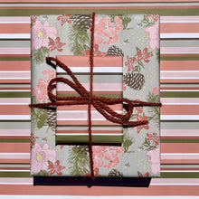 Load image into Gallery viewer, Giftwrapped package with two boxes, one in a pink &amp; olive floral pattern with pinecones, one in a pink &amp; olive stripe

