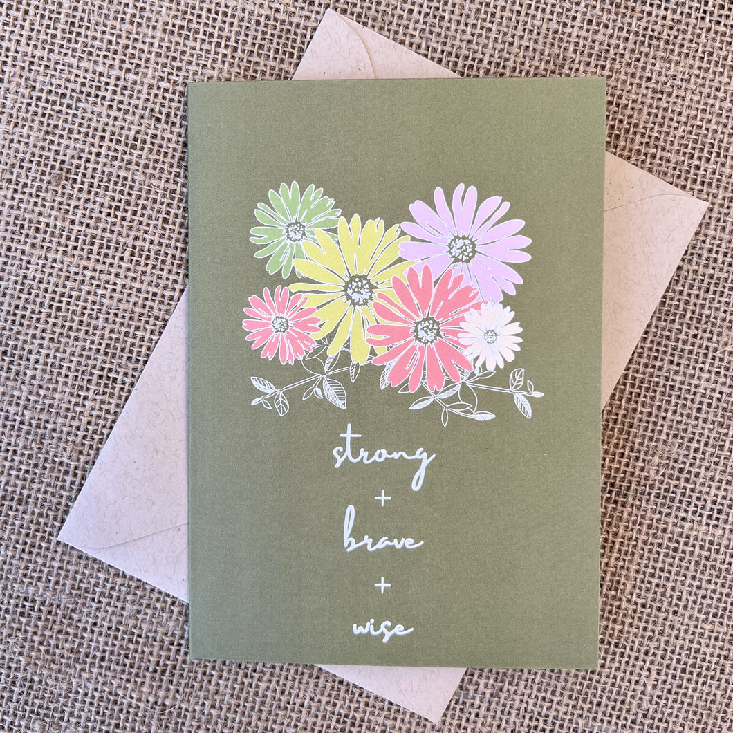 Greeting card with olive green background and colorful daisy flowers, text reading 