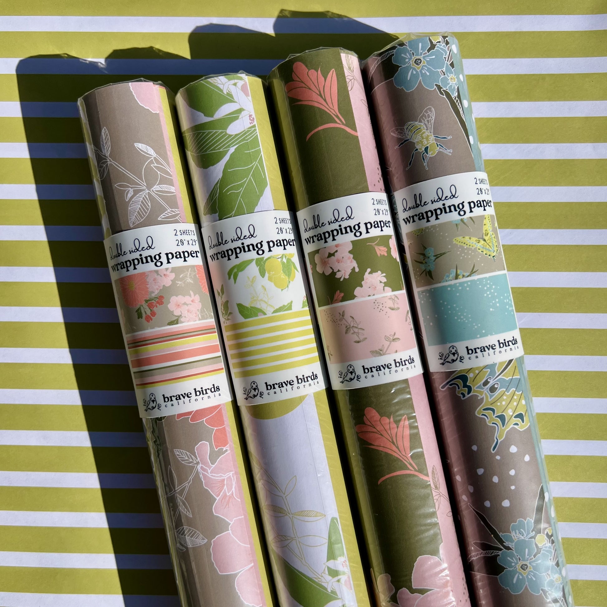 Packaged rolls of all 4 double sided wrapping paper patter options