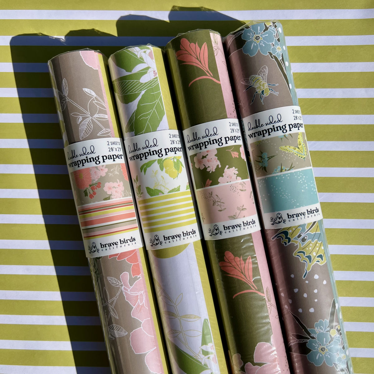 Packaged rolls of all 4 pattern options of double sided wrapping paper