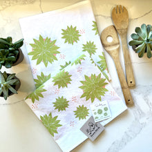 Load image into Gallery viewer, Succulent print tea towel folded on a kitchen counter, styled with wooden spoons and real succulent plants
